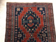 A Caucasian rug, the central panel set w