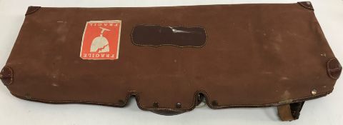 A James Purdey and Sons brass embellished leather covered oak framed motor case with canvas outer