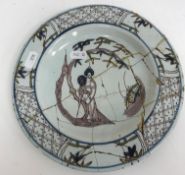 Two 18th Century Bristol Delft plates, the centrefields decorated with woman and fan beneath a tree,