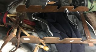 A collection of sporting items to include a child's leather general purpose pony saddle,