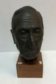 A mid 20th Century bust of a gentleman set on a square mahogany base bearing label inscribed 