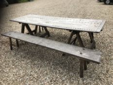 A weathered teak trestle table 88 cm wide x 254 cm long together with two long benches 31.