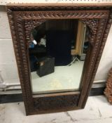 Four various Middle Eastern carved teak framed wall mirrors