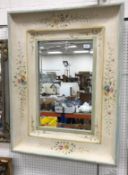 A modern floral painted swept framed rectangular wall mirror with bevel edged plate 74.