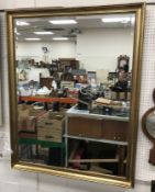 A modern beaded and swept framed rectangular wall mirror with bevel edge plate 99 cm wide x 127 cm