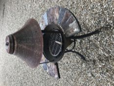 A barbecue in the form of a wishing well,