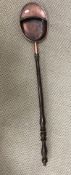 A 19th Century copper collection pan with gadrooned edging and turned wooden handle 108 cm long