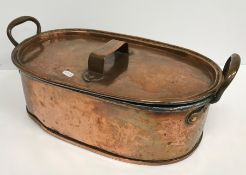 A 19th Century copper twin-handled fish kettle / lidded pan, the lid and base both incised 
