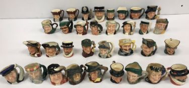 WITHDRAWN A collection of miniature Royal Doulton Toby jugs comprising 