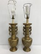A pair of 20th Century brass table lamps as Chinese vases with phoenix handles and relief work