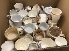 A collection of Royal Commemorative mugs, a teapot, plates, etc.