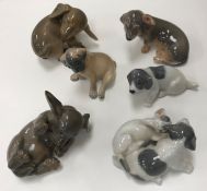 A collection of six various Royal Copenhagen dog / puppy figures including 