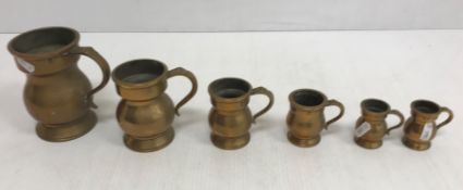 A graduated set of six Victorian brass m