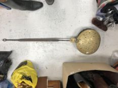 A 17th Century iron handled brass plague