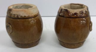 A pair of Chinese treacle glazed pottery
