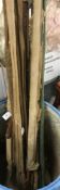 A collection of various fishing rods to