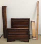 A modern mahogany single sleigh bed with
