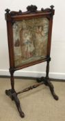 A Victorian rosewood framed fire screen,