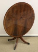 A Regency style yew wood breakfast table