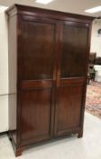 A circa 1900 mahogany two door wardrobe