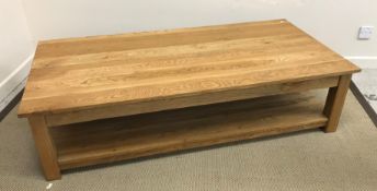 A modern oak two tier coffee table on sq