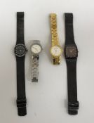A collection of four Skagen Denmark wris