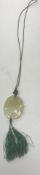 A Chinese pale jade pendant depicting a