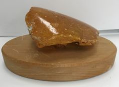 An uncut natural amber section polished