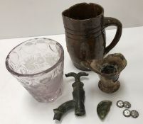 An early 18th Century manganese treacle glazed pottery jug, 12.