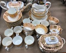 A 19th Century Derby part tea / coffee set, salmon pink and gilt banded with foliate decoration,