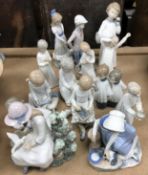 A collection of fourteen various Nao by Lladro figures various, tallest 21 cm,