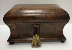 An early 19th Century walnut and parquetry inlaid tea caddy,