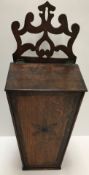 An 18th Century North Country oak and inlaid candle box of tapering form,