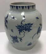 A late 18th / early 19th Century Chinese blue and white vase decorated with floral sprays, 25.