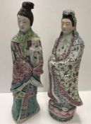 A Chinese famille rose porcelain figure of a lady in robes, standing upon a lotus flower,