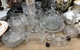 A collection of various cut glass ware including four various jugs, three decanters,