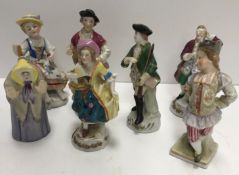 A collection of 26 Continental miniature porcelain figures including Sitzendorf, Schierholz,