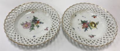 A pair of 19th Century Copenhagen floral spray decorated ribbon plates with gilt edge borders,
