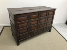 An 18th Century Welsh oak mule chest, the plain rising top with moulded edge,