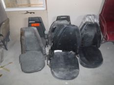 Six various aeronautical pilot's seats and a similar seat frame