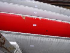 A pale grey painted aircraft tail fin section inscribed 