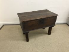 An 18th Century oak box, the two plank top with moulded edge over plain front and sides,