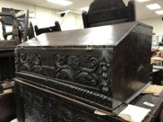 A 18th Century oak Bible box, the plain top above a sloping fall enclosing a single drawer,