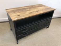 An Ercol elm rectangular coffee table on six baluster turned legs to block feet united by