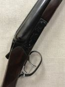 A Baikal Model 43EM 12 bore shotgun, double barrel, side by side, box lock ejector, 27.