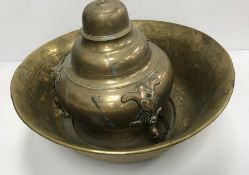 A Middle Eastern Islamic engraved brass