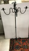 A wrought iron four branch five light ca