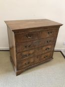 An 18th Century walnut chest, the plain