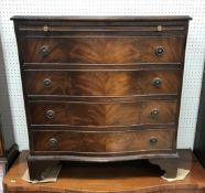 A 20th Century mahogany serpentine front