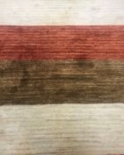 A modern striped rug in terracotta, brow